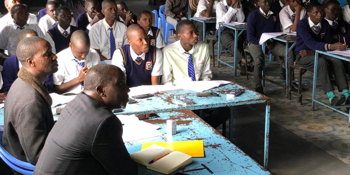 Mr. Waweru (Principal), Mr. Laban(D.O.S) and students during a movivational speaking by Mr Sam Vidambu